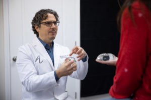 Dr. Andrew Lofman discussing implant sizes